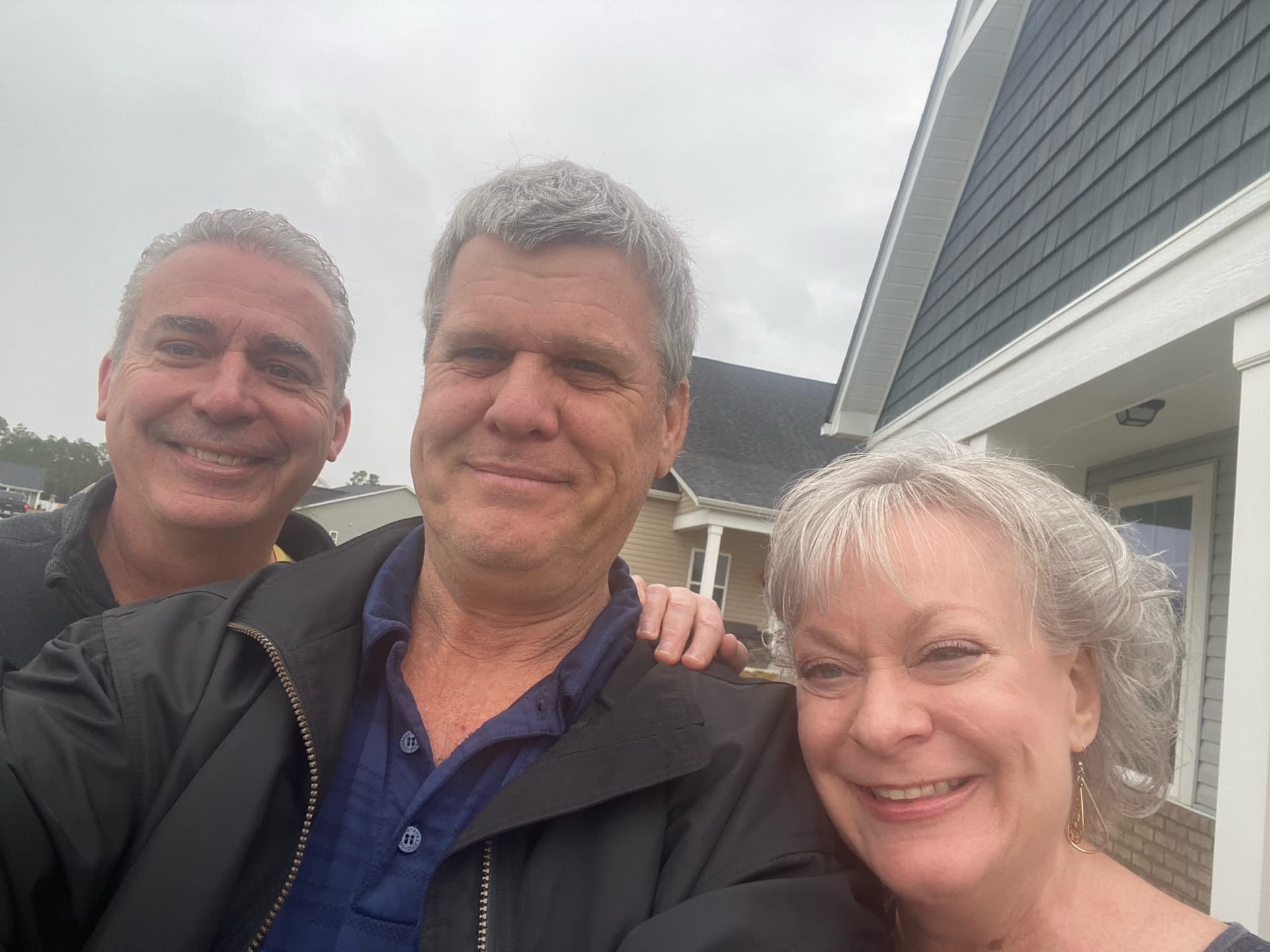 Satisfied home buyers with Lightkeeper Realty team