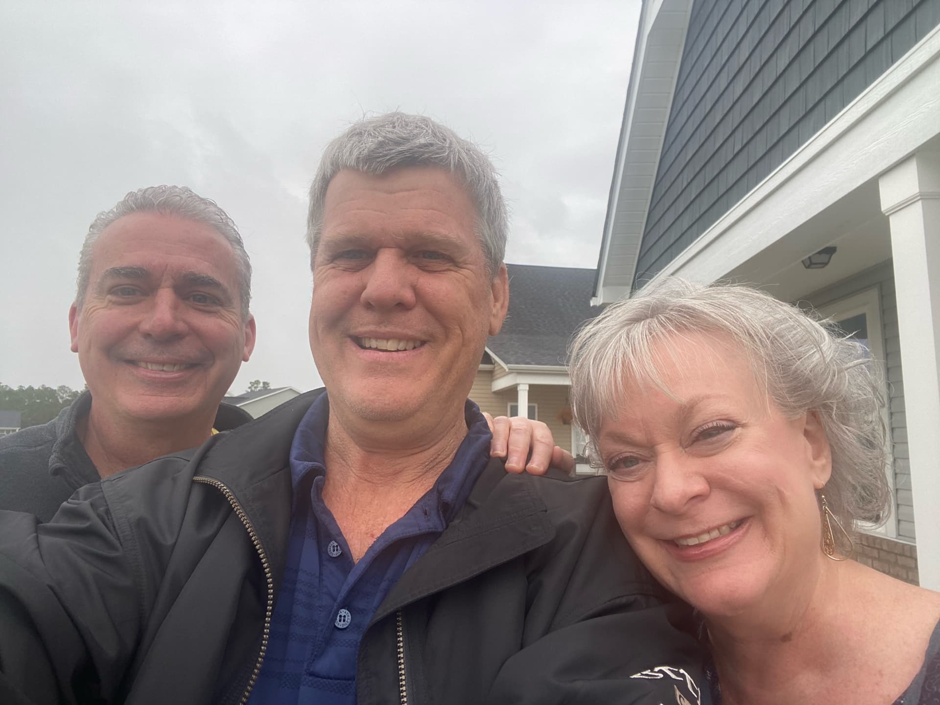 Happy clients with Lightkeeper Realty agents at closing