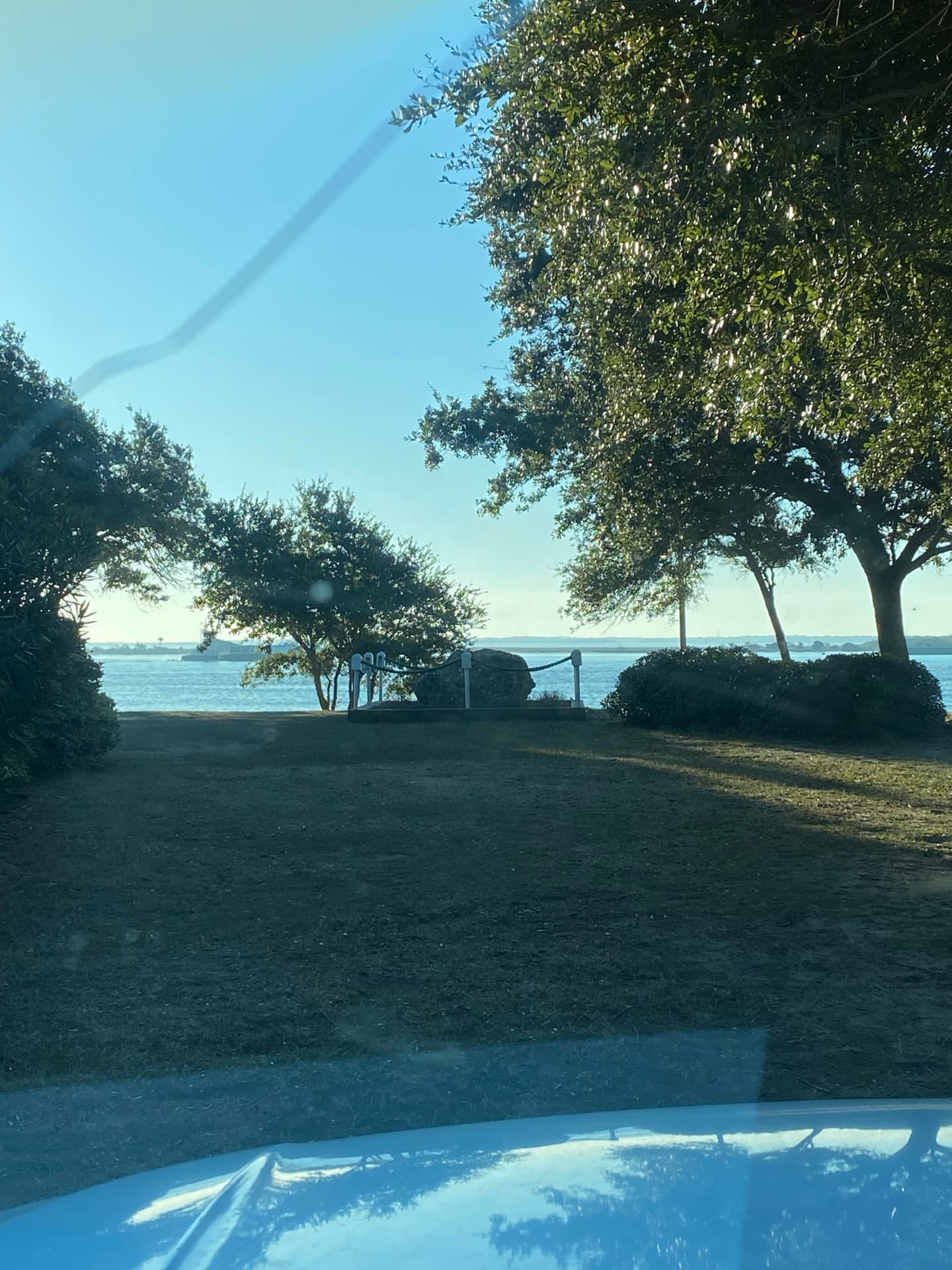 Waterfront view with oak trees