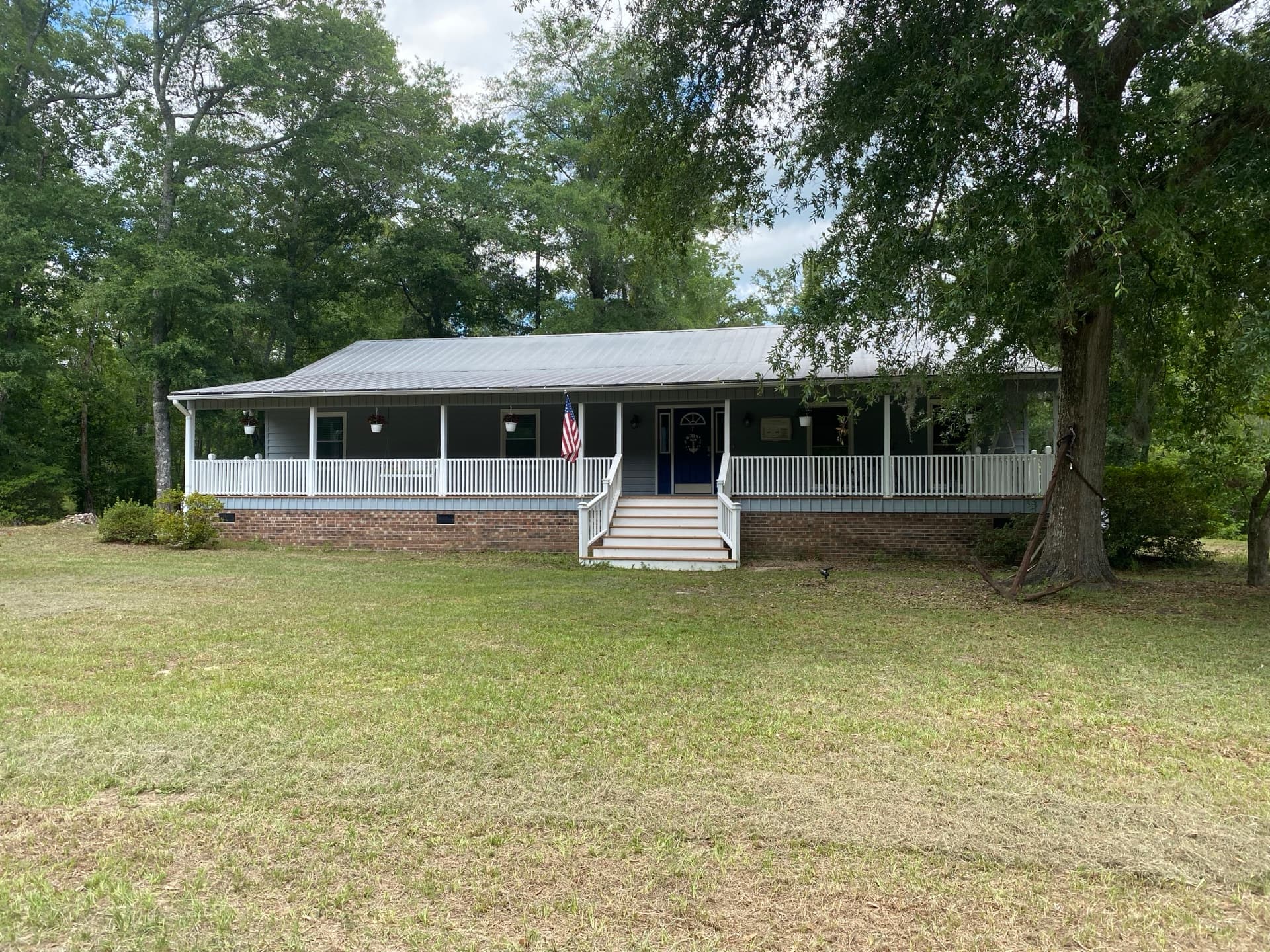 Ranch-style home with metal roof